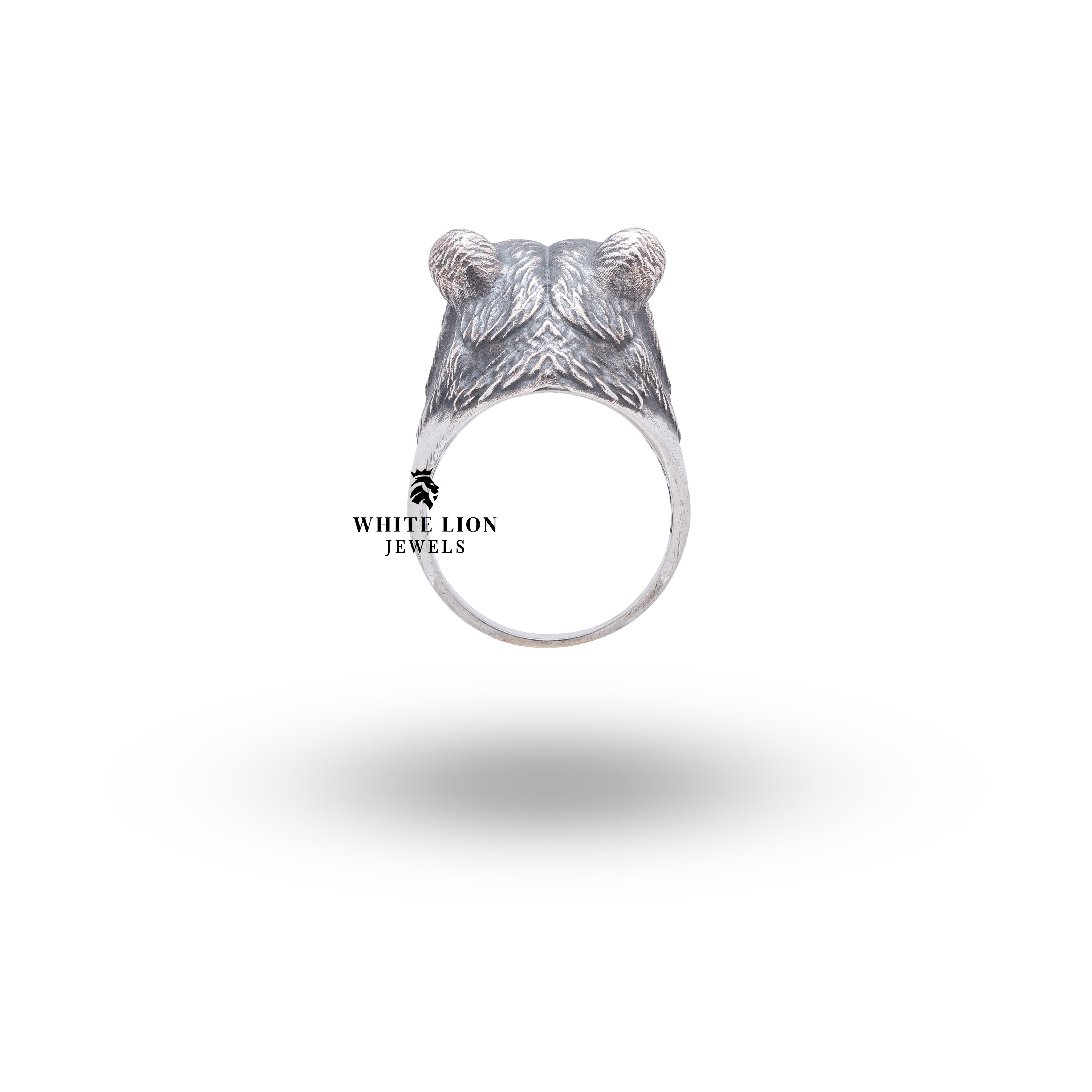 Feminine Bear 925 Sterling Silver Ring set against a rustic background