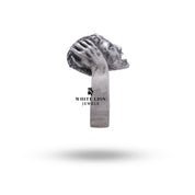 Brain Clever Ring displayed with luxury accessories.