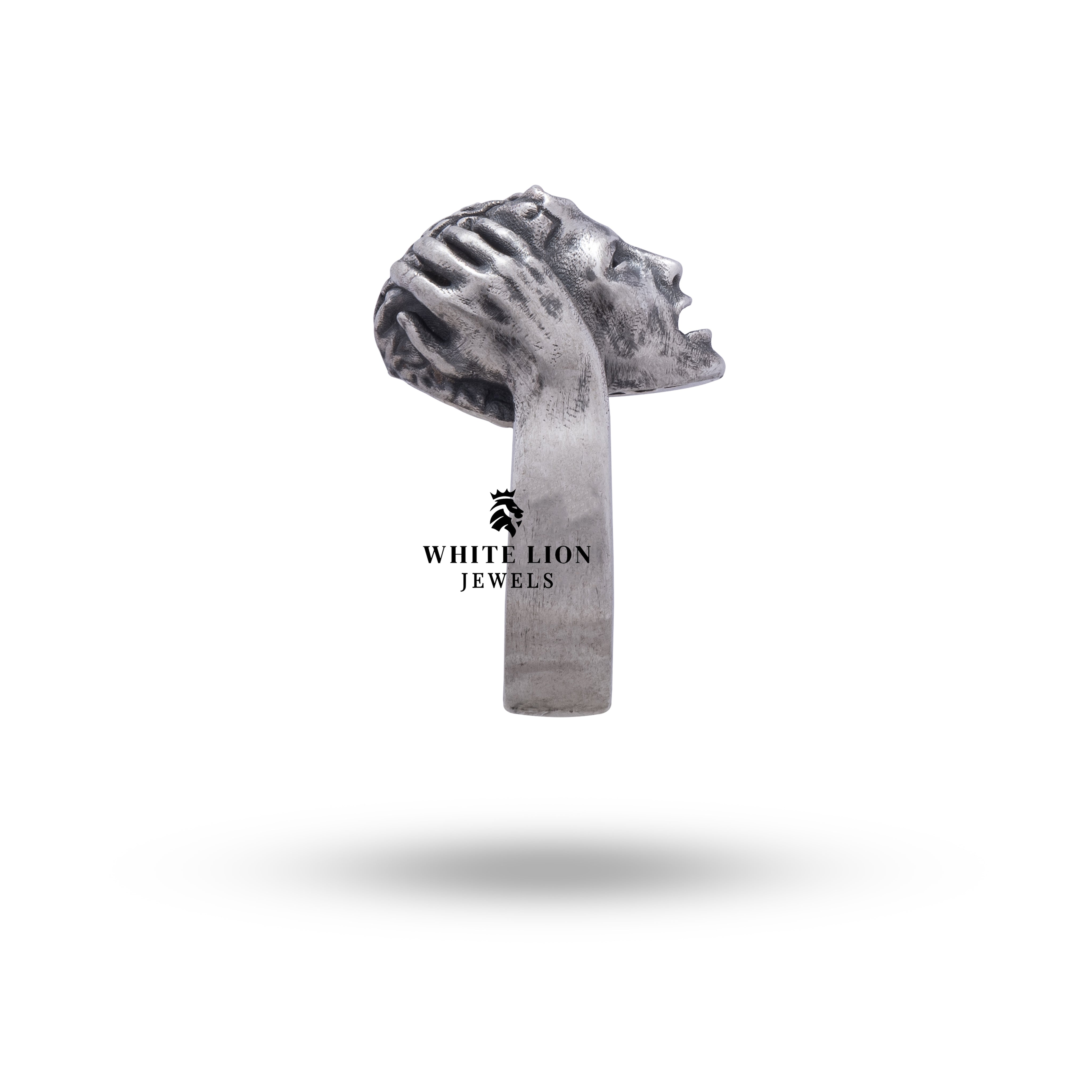 Brain Clever Ring displayed with luxury accessories.